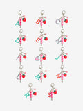 Bag charm keyring with strawberry star charms and lip gloss (British brand)