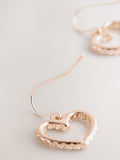 Rose gold tone pavé heart drop earrings, imported from the UK