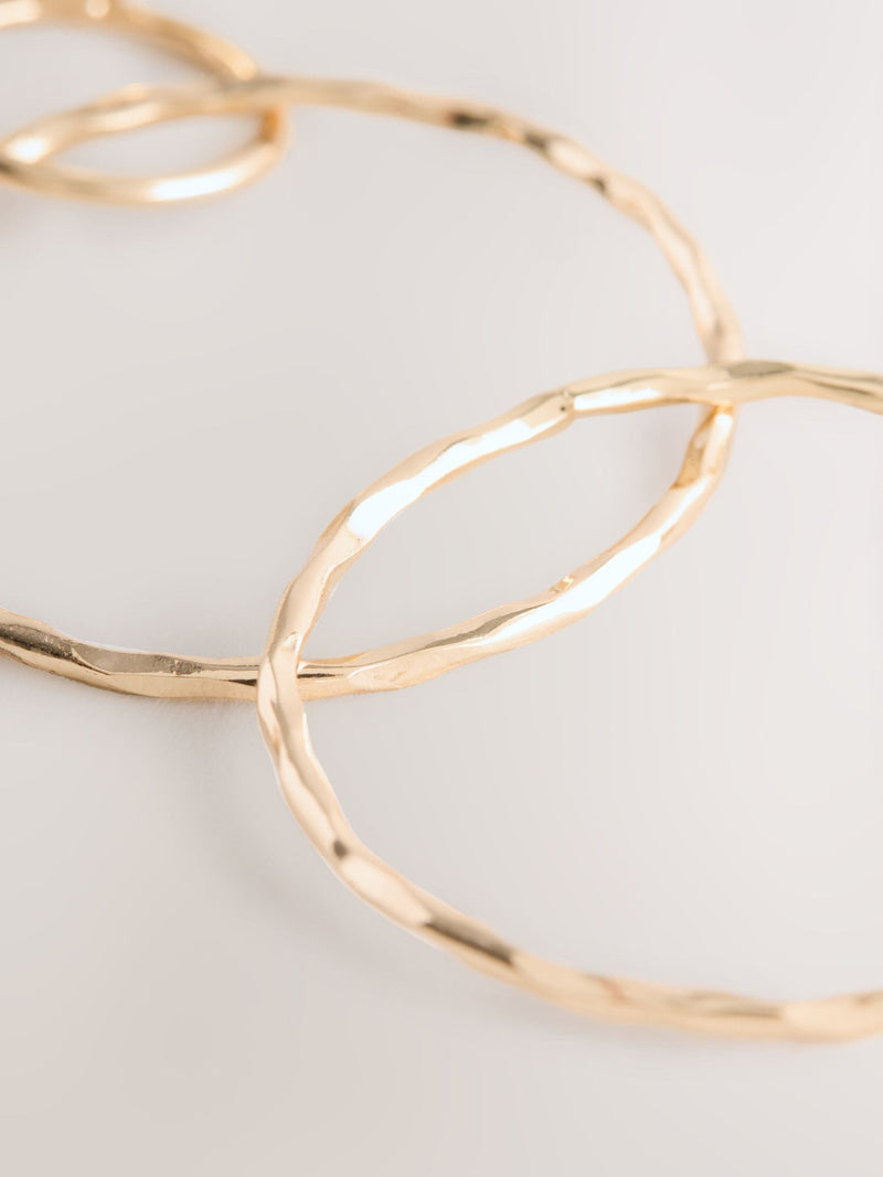 Gold Tone Circle Drop Earrings 91% Recycled brass, UK version