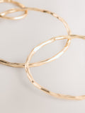 Gold Tone Circle Drop Earrings 91% Recycled brass, UK version