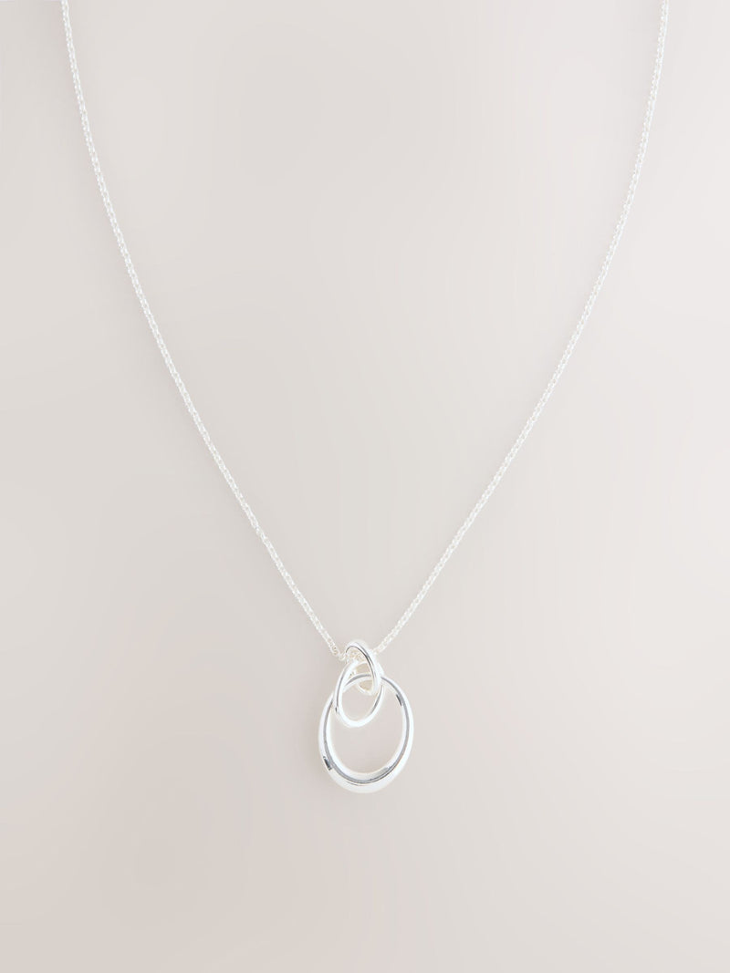 Silver tone interlocking circle pendant necklace, UK version