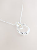 Silver tone interlocking circle pendant necklace, UK version