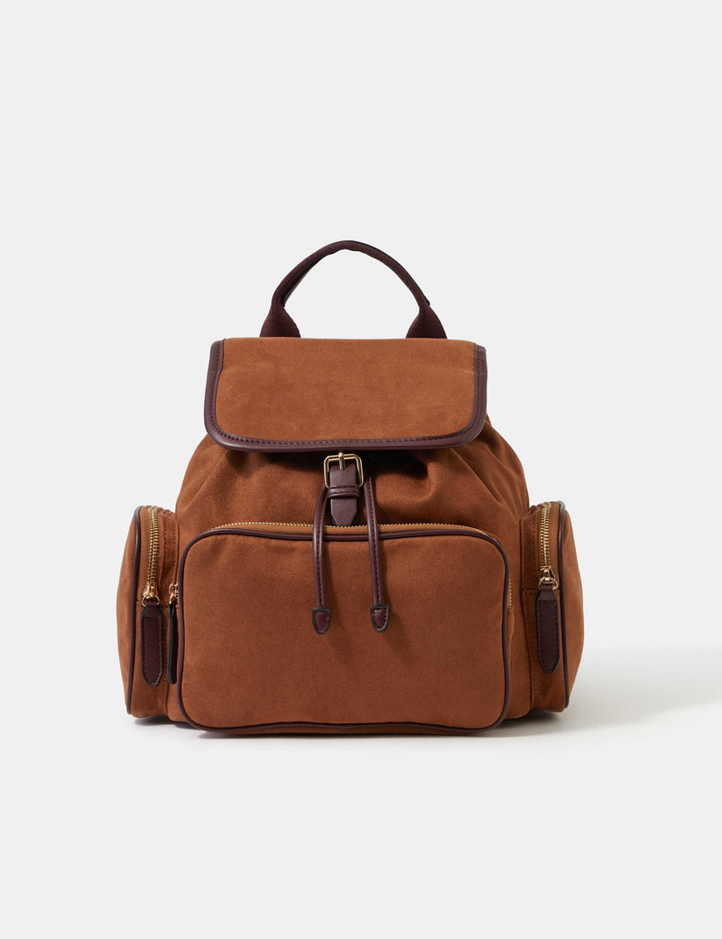 Accessorize faux suede backpack with gold hardware, imported from the UK