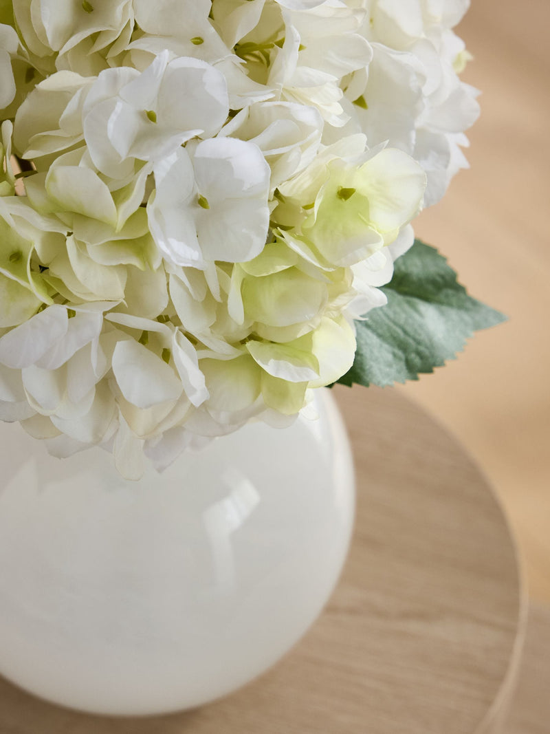 White artificial hydrangea arrangement in swirl glass vase - British product