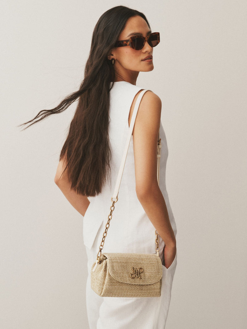 Raffia effect cross-body bag with gold clasp (British brand)