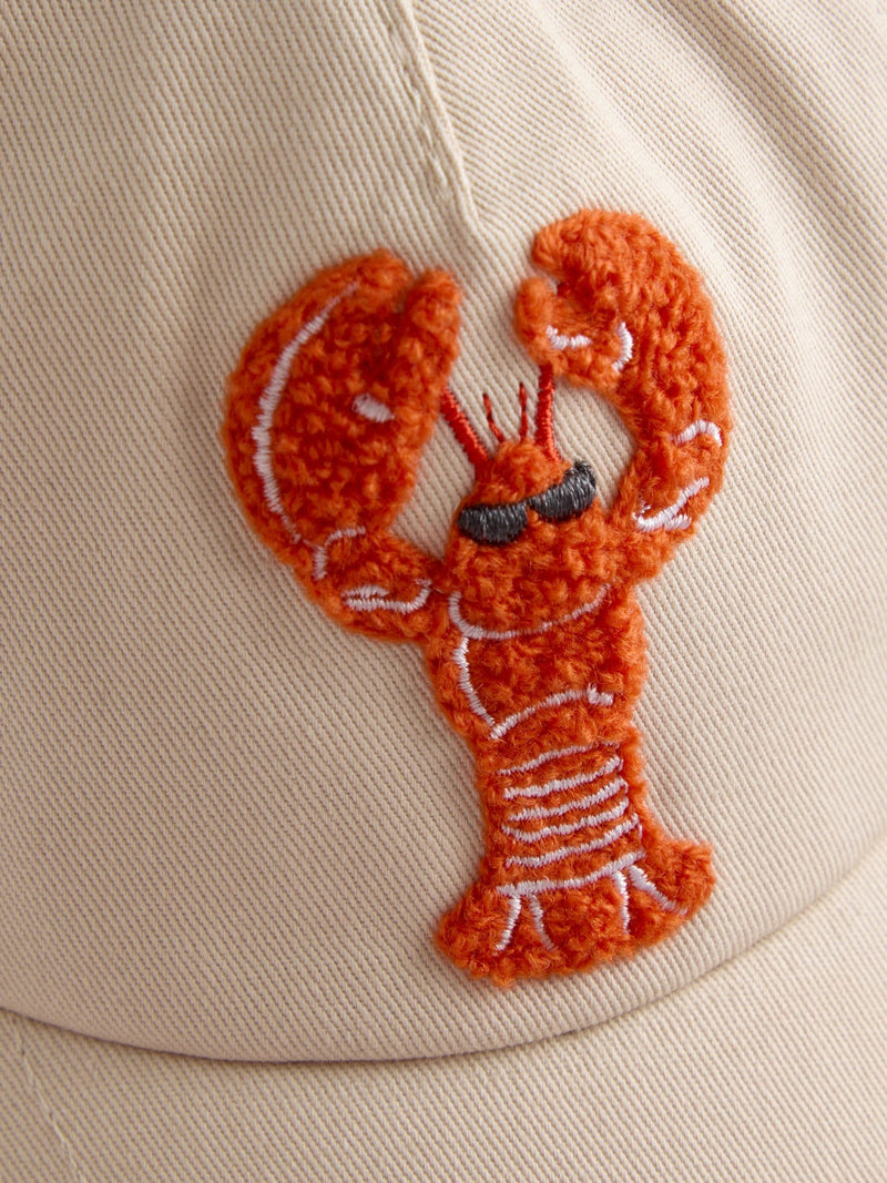 JoJo Maman Bébé ecru lobster bouclé cap, imported from the UK