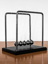 Next MenKind Black In Genious Newton's Cradle Desk Toy- Buy online at McGrocer