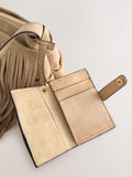 Stone suedette cross-body bag with fringe detail (British brand)