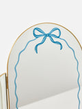 Oliver Bonas gold bow arch mirror 37cm, imported from the UK