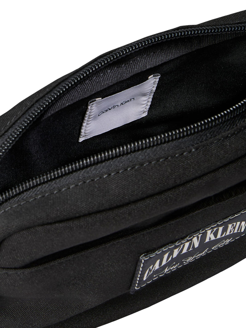 Calvin Klein black cross-body bag, imported from the UK