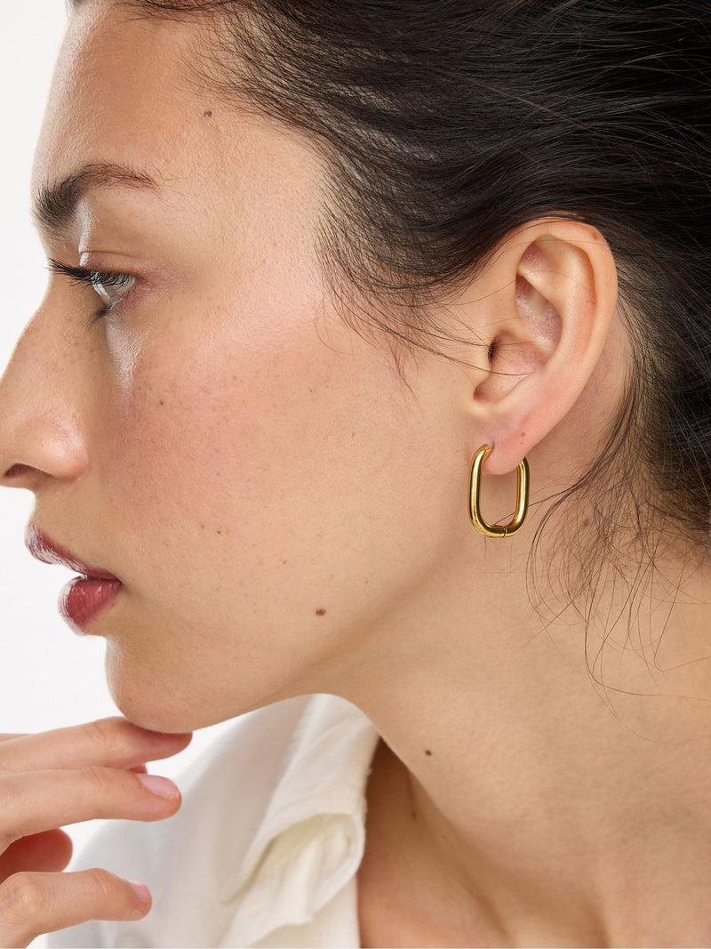 Oliver Bonas gold tone oval hoop earrings, imported from the UK