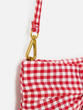 Oliver Bonas red gingham bow clutch bag with gold zip, UK version