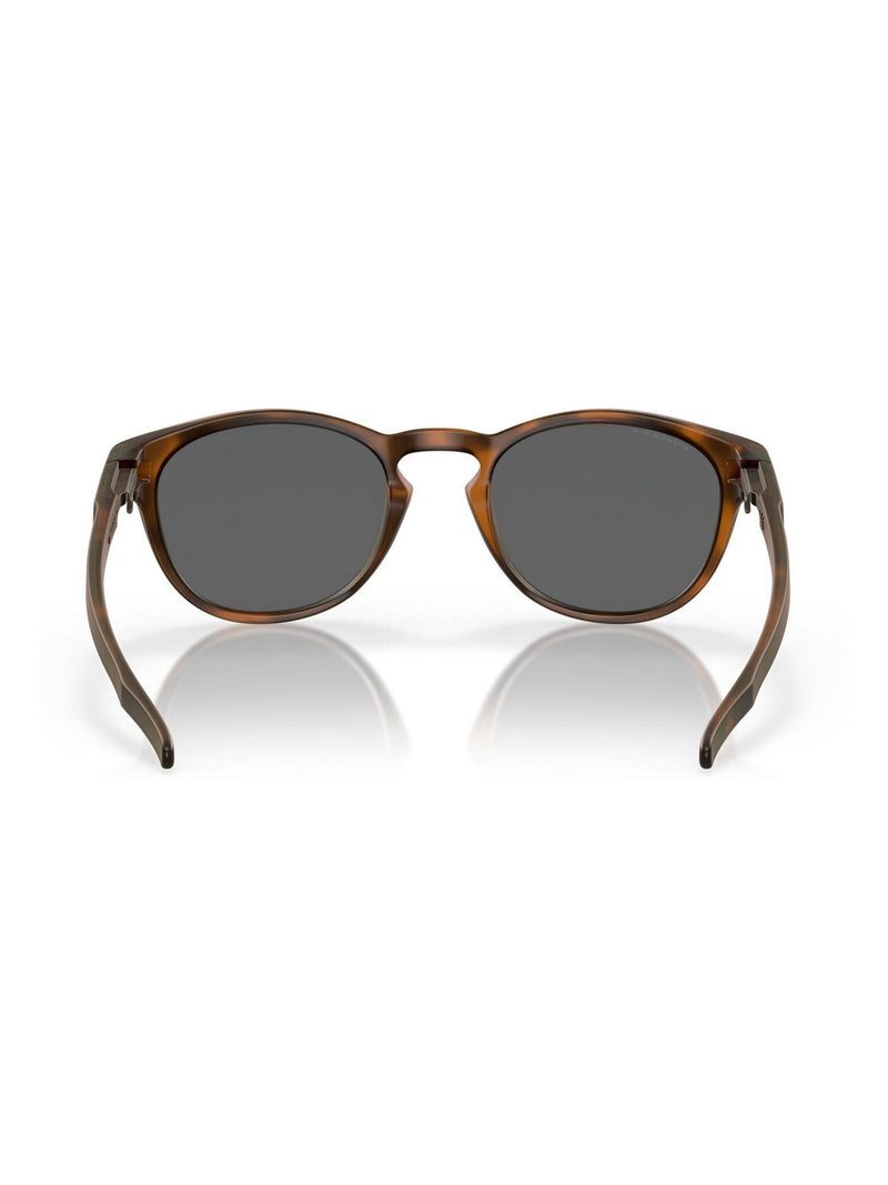 Oakley Latch Oval sunglasses brown tortoise Prizm Black, imported from the UK