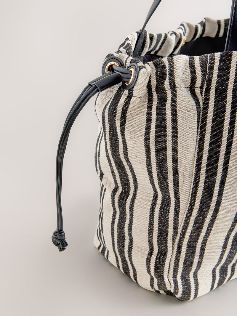Black and white stripe drawstring shoulder bag, imported from the UK