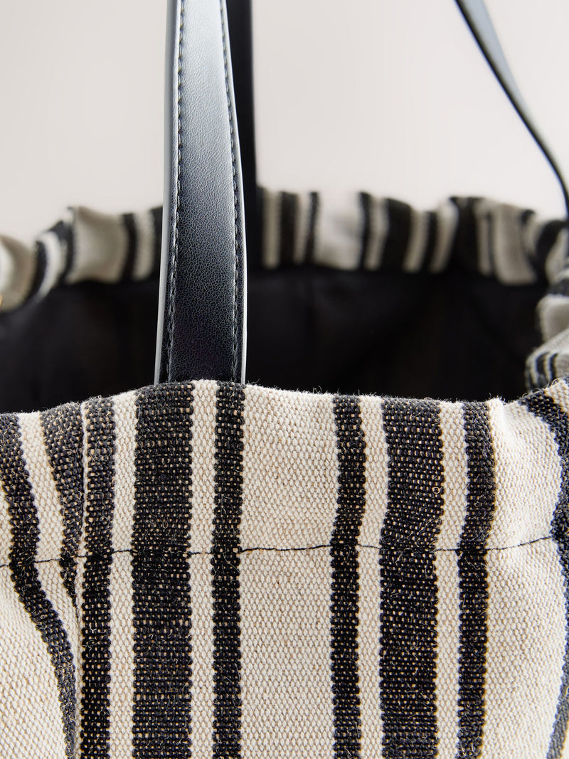 Black and white stripe drawstring shoulder bag, imported from the UK