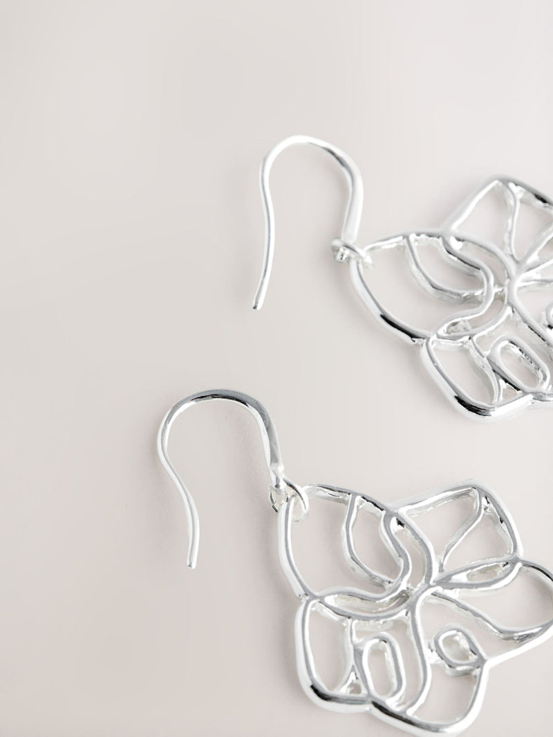 Silver tone flower drop earrings with fish-hook fastening, UK version