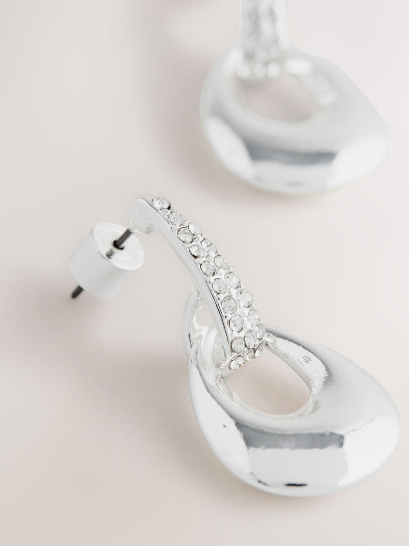 Silver-tone drop pendant earrings with diamond detailing, UK version