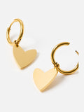 Oliver Bonas gold tone heart huggie earrings, imported from the UK