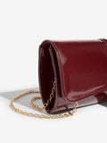 Lipsy burgundy red tassel trim clutch bag, UK version