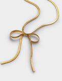 Katie Loxton gold coated ribbon bow necklace, UK version