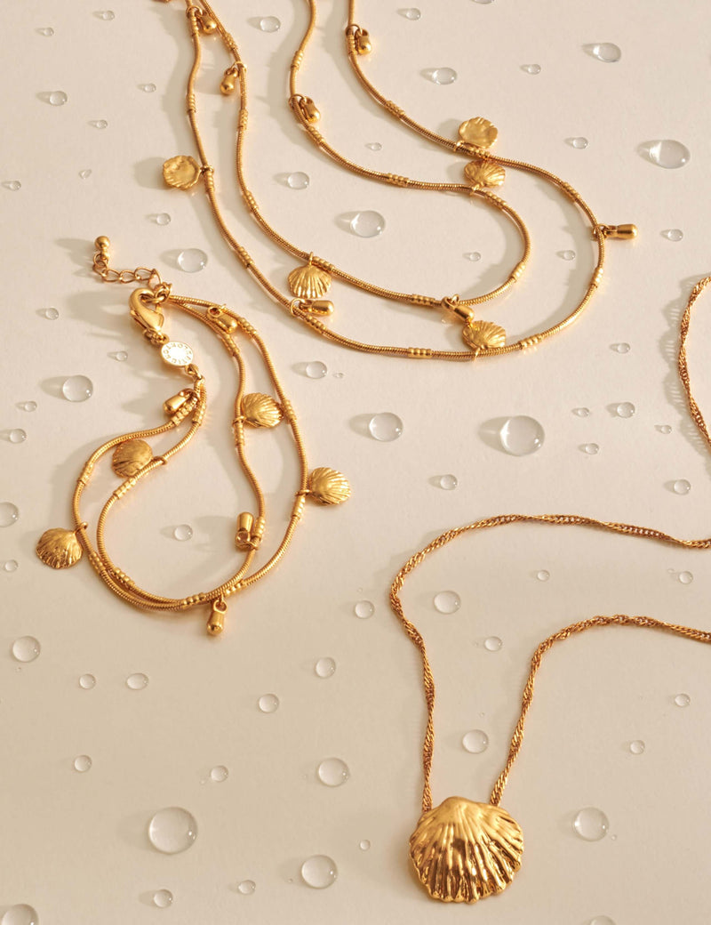 Katie Loxton gold plated bracelet with shell charms, imported from the UK