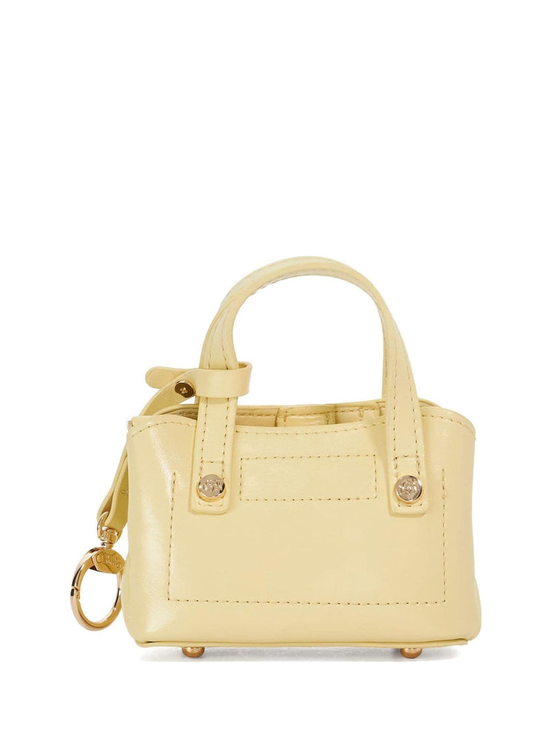 Dune London micro bag charm yellow (British brand)