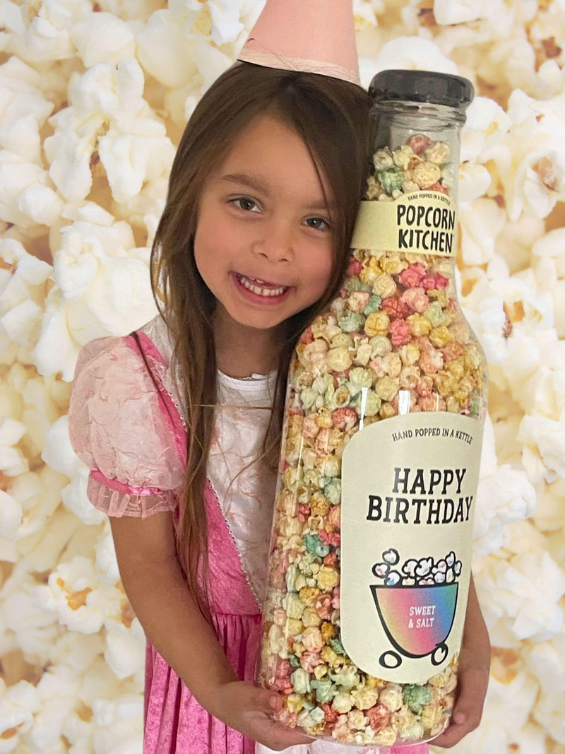 Popcorn Kitchen birthday popcorn gift bottle with sweet and salt rainbow colours, imported from the UK