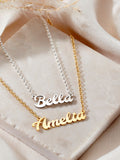 Posh Totty Designs gold tone curved name necklace, imported from the UK