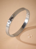 Stainless steel bangle (British brand)