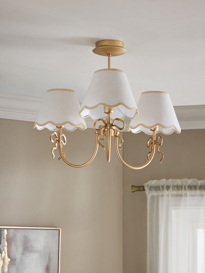 Brass bow chandelier with delicate scalloped shades - British product