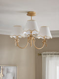 Brass bow chandelier with delicate scalloped shades - British product