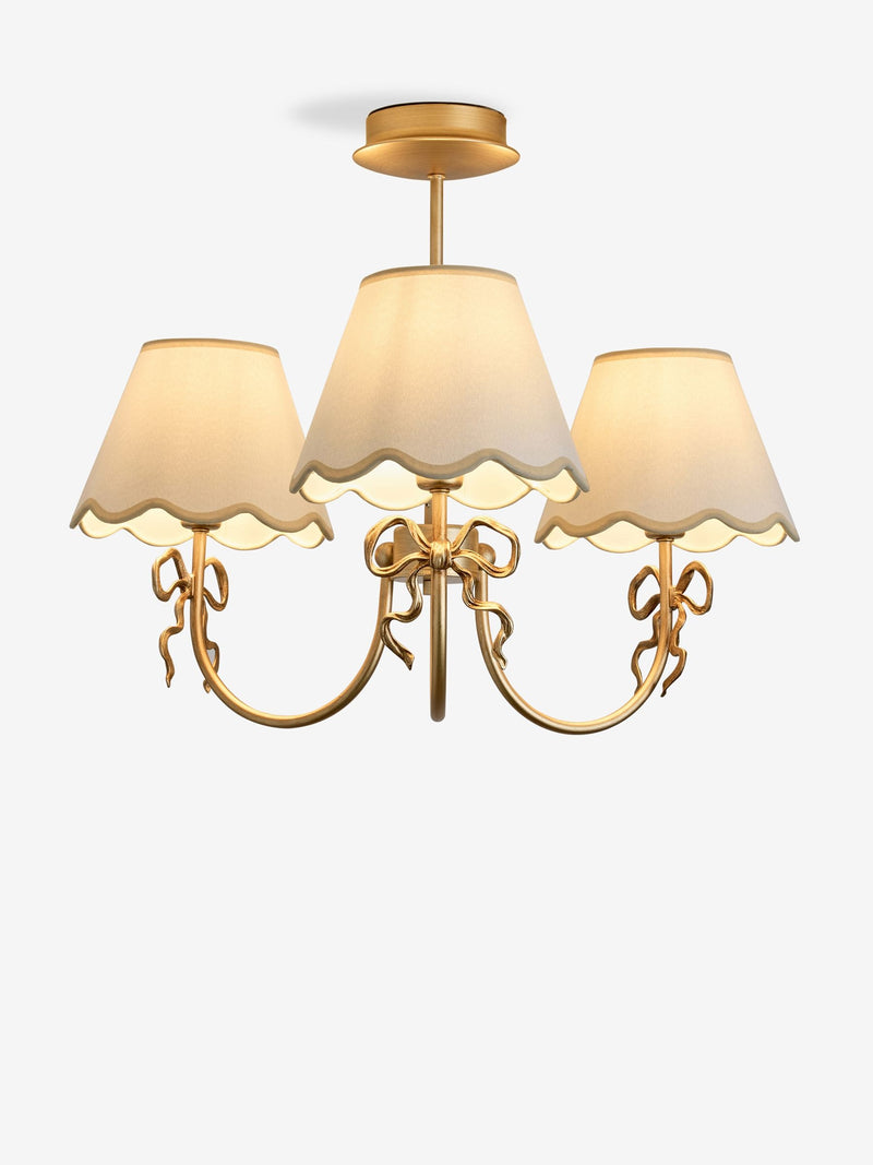 Brass bow chandelier with delicate scalloped shades - British product