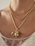 Gold tone flower necklace with long chain, UK version
