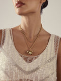 Gold tone flower necklace with long chain, UK version