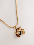 Gold tone flower necklace with long chain, UK version