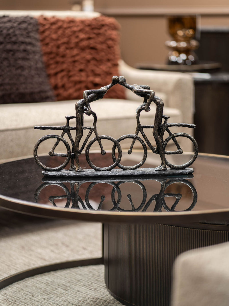 Libra Interiors bronze smooching cyclist sculpture, 28cm height, UK version
