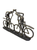 Libra Interiors bronze smooching cyclist sculpture, 28cm height, UK version