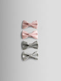 JoJo Maman Bébé glitter bow clips 4-pack, imported from the UK