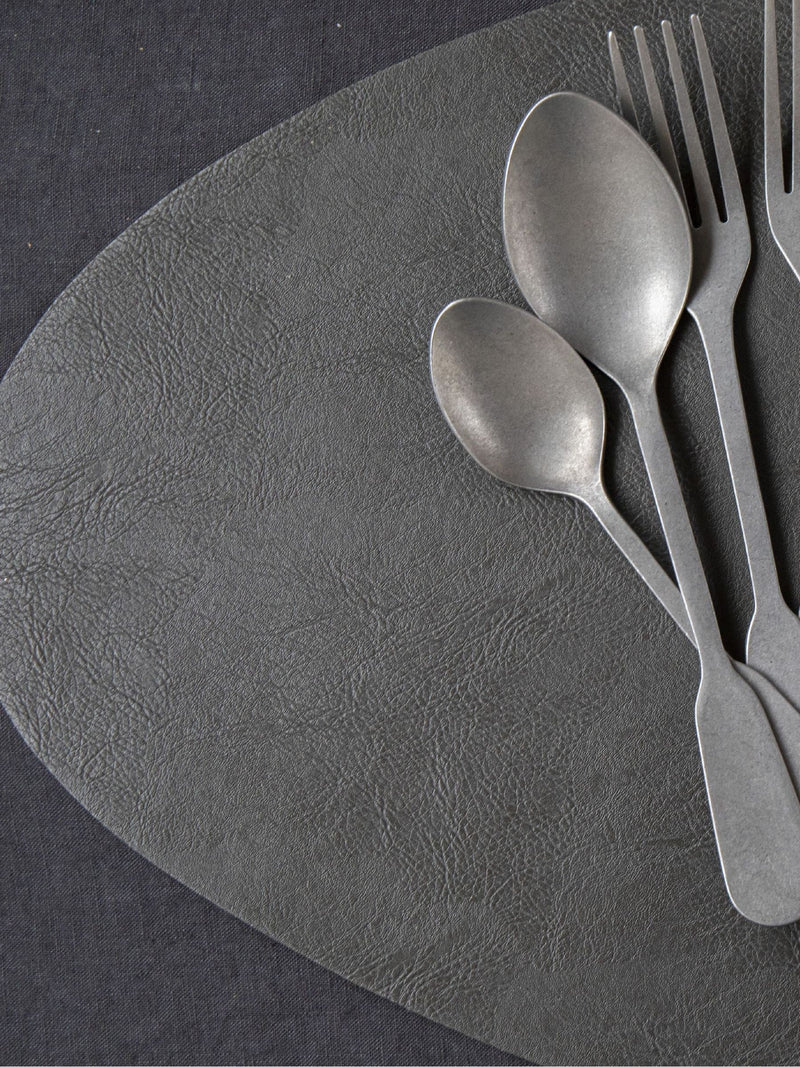 Mikasa black pebble-shaped faux leather placemat set of 4, imported from the UK