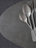 Mikasa black pebble-shaped faux leather placemat set of 4, imported from the UK