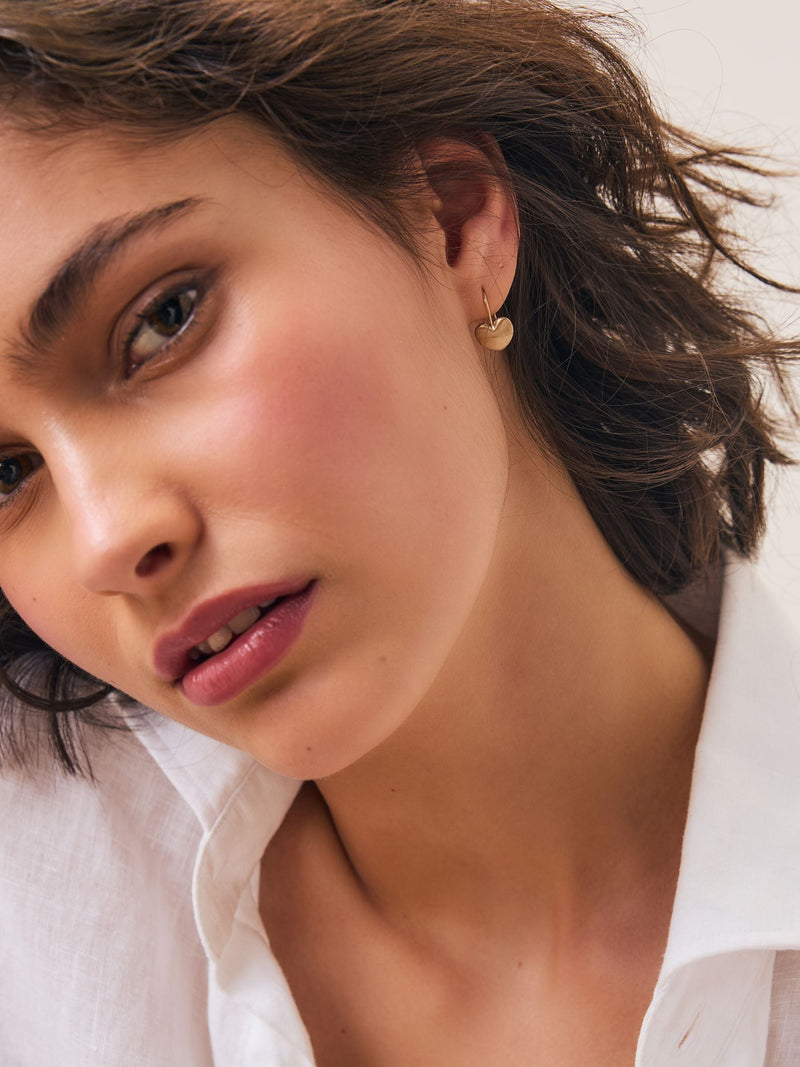 Brushed gold tone heart pierced earrings - British product