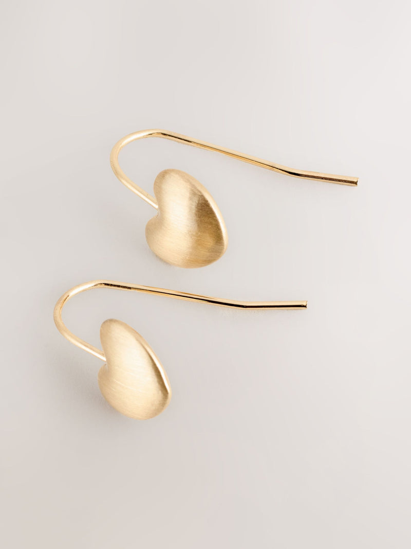 Brushed gold tone heart pierced earrings - British product