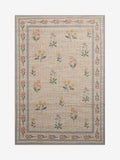 Natural jute rug with floral border, imported from the UK