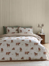 Next Catherine Lansfield Natural Angus Highland Cow Reversible Duvet Cover Set- Buy online at McGrocer