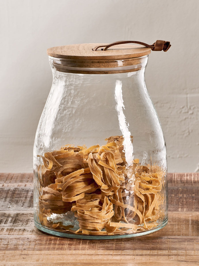 Nkuku Clear Shaan glass storage jar with wood lid, 25.5cm height, imported from the UK