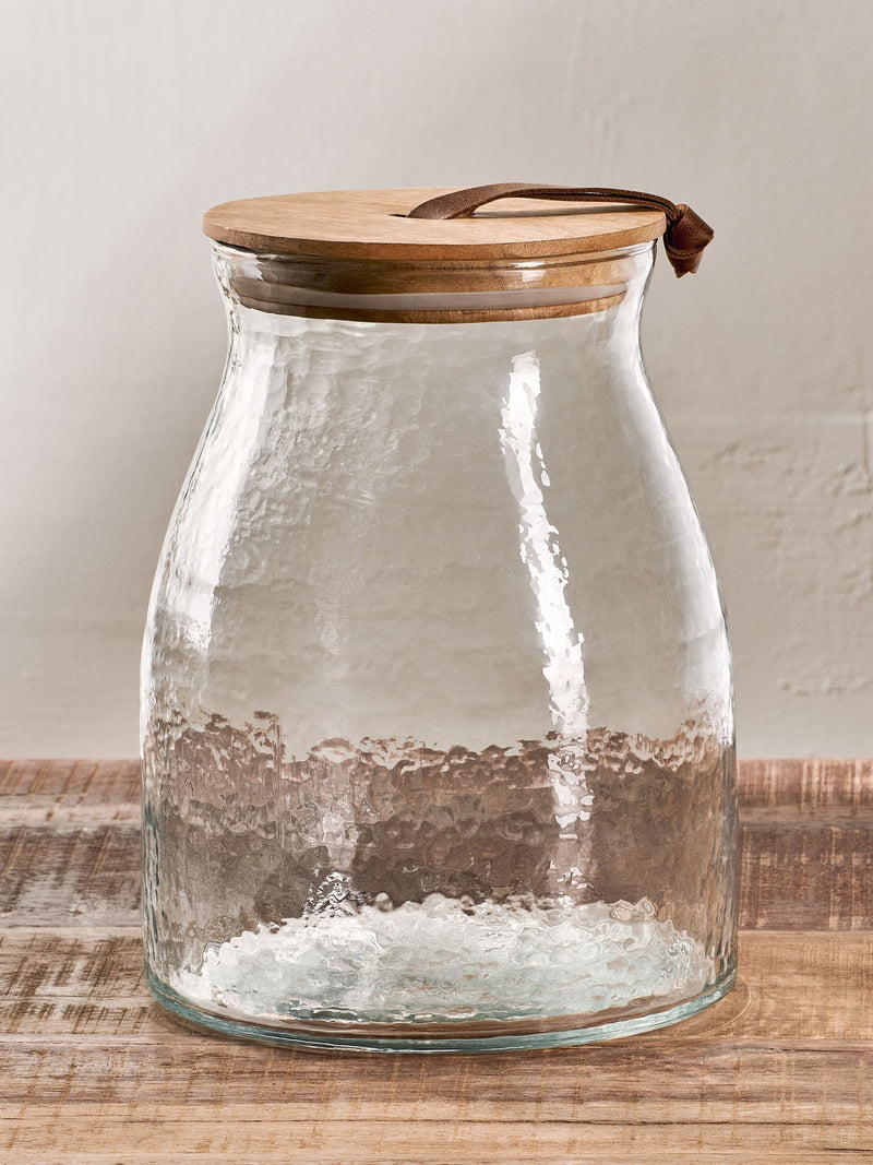 Nkuku Clear Shaan glass storage jar with wood lid, 25.5cm height, imported from the UK