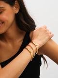Jon Richard gold plated stainless steel waterproof bangle, UK version