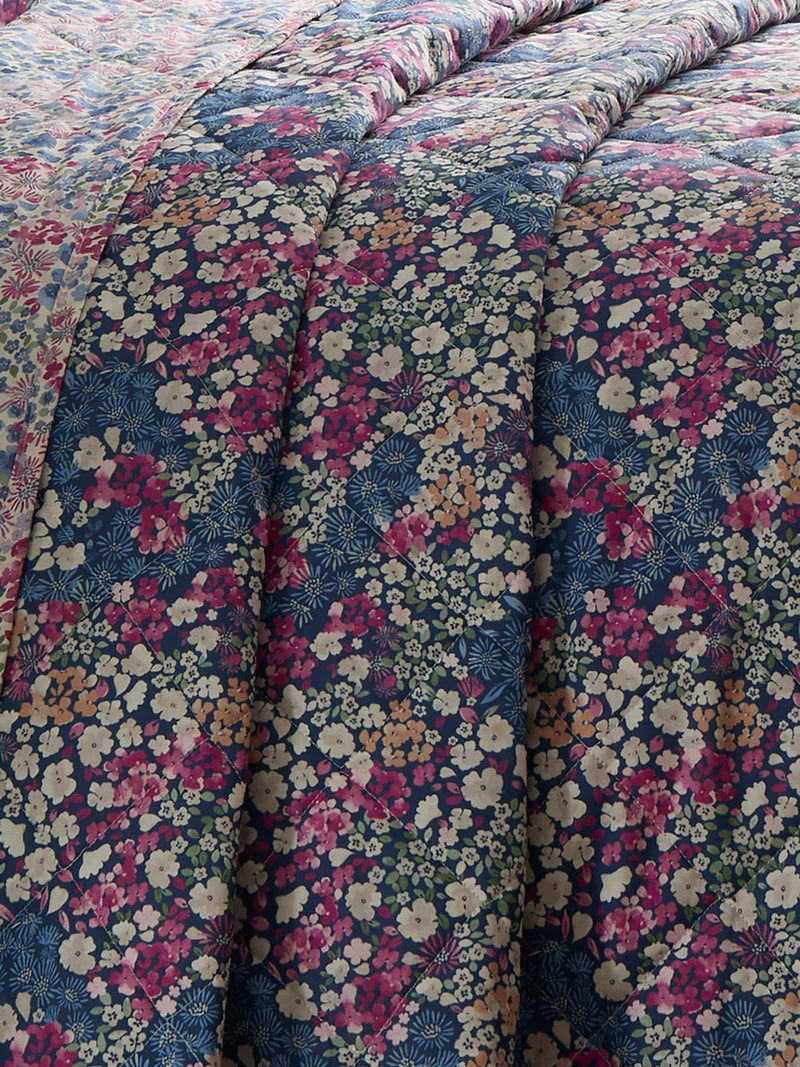 Dreams & Drapes Bessie navy quilted bedspread with floral print, UK version