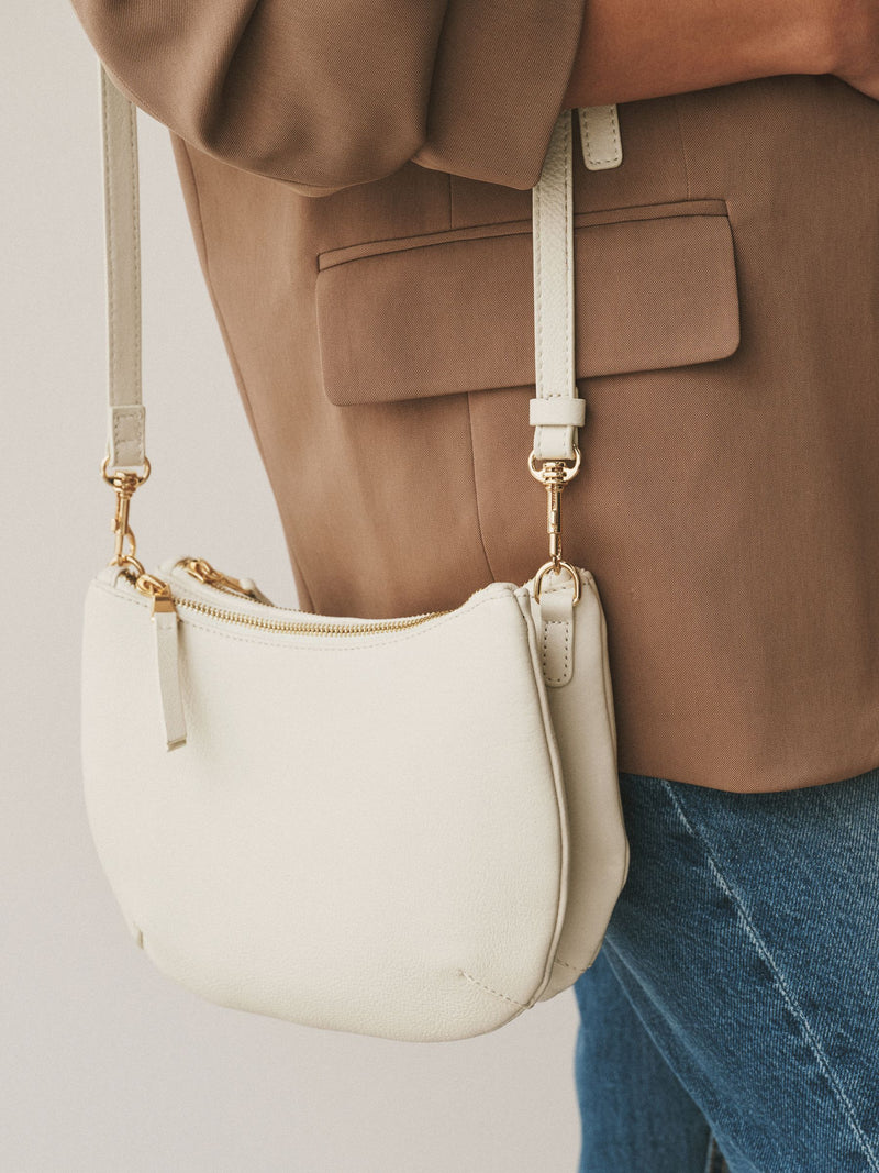 White leather scoop cross-body bag with adjustable strap, UK version