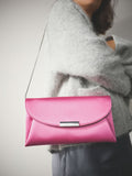 Pink clutch bag with chain strap (British brand)